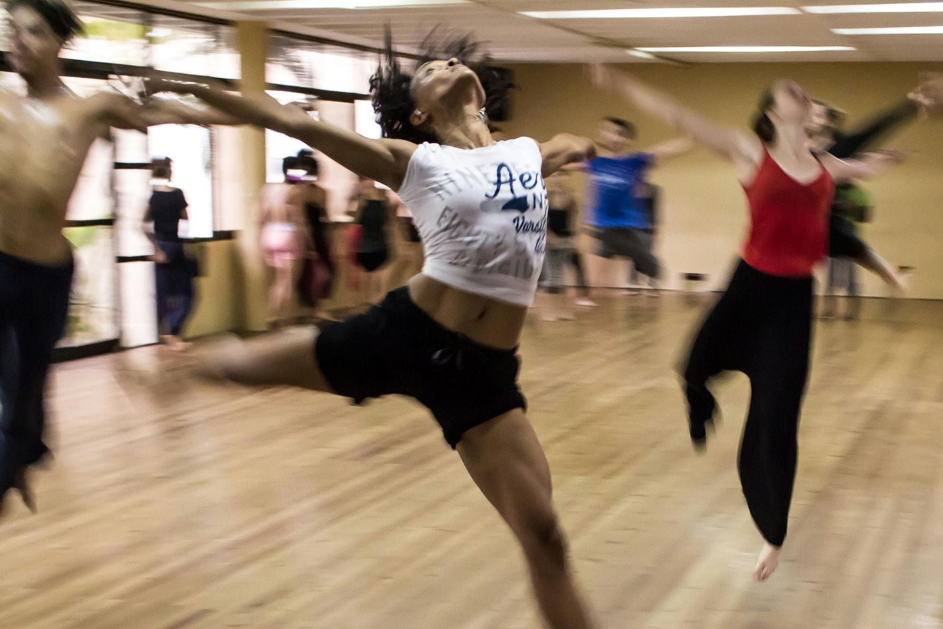 Dances dancing in a dance studio